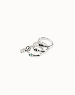 Anillo triple bañado en plata de ley con cristales azules.