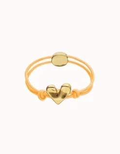 Pulsera de hilo elástico naranja con corazón bañado en oro 18k