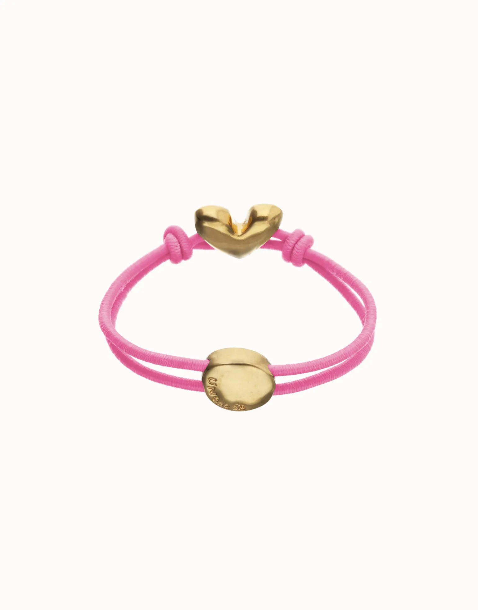 Pulsera de hilo elástico rosa con corazón bañado en oro 18k