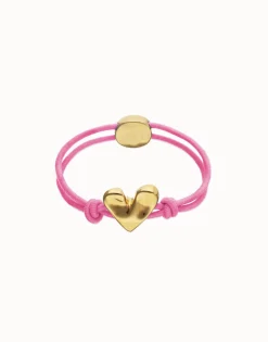 Pulsera de hilo elástico rosa con corazón bañado en oro 18k