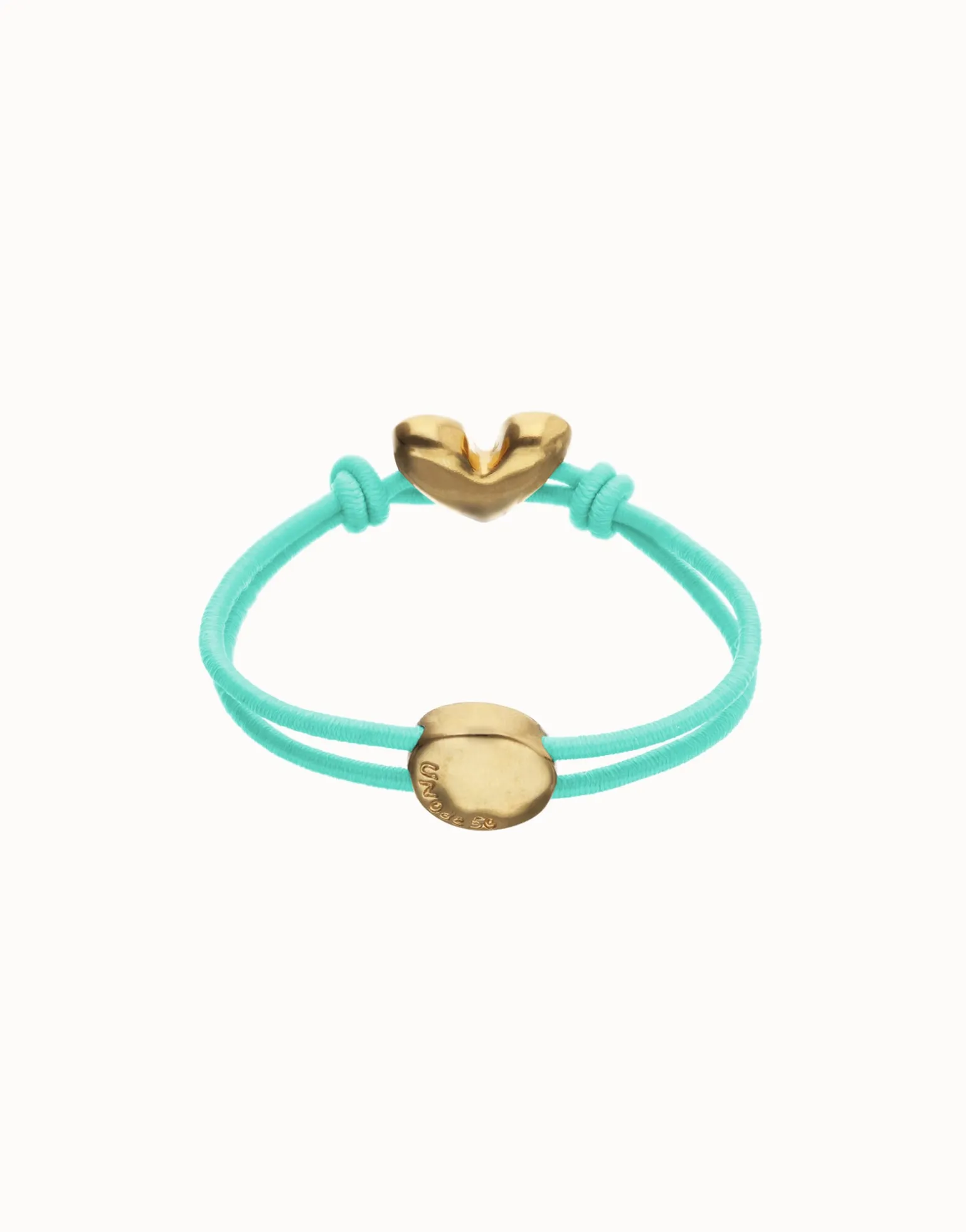 Pulsera de hilo elástico turquesa con corazón bañado en oro 18k