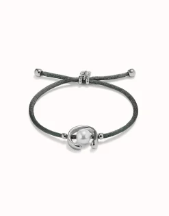 Pulsera de hilo negroso con perla shell fornitura bañada en plata de ley.