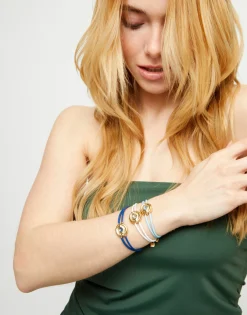 Pulsera doble de cuero celeste con ojo bañado en oro 18k