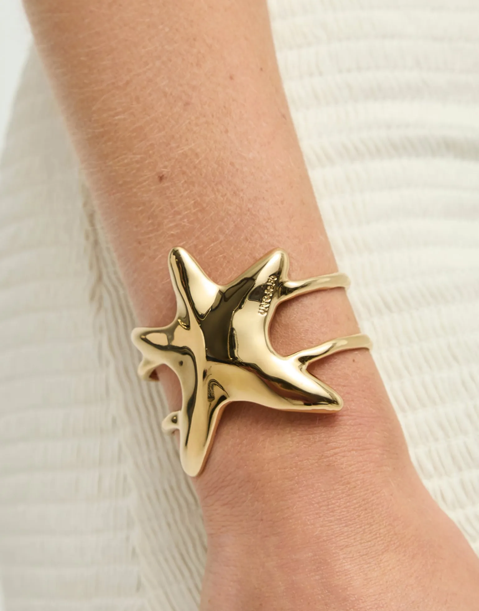 Pulsera rígida doble bañada en oro estrella de mar
